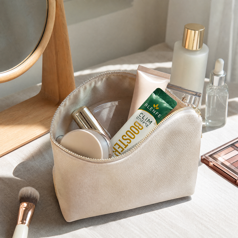 BLENFE Slim Coffee Booster stick pack in a travel vanity bag