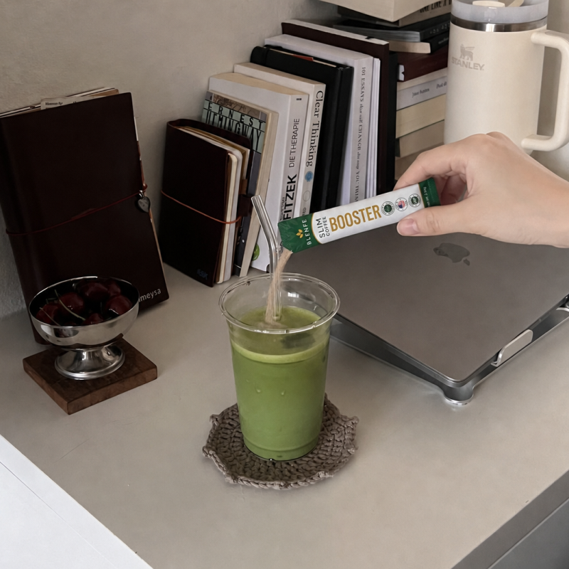Pouring BLENFE Slim Coffee Booster into a drink